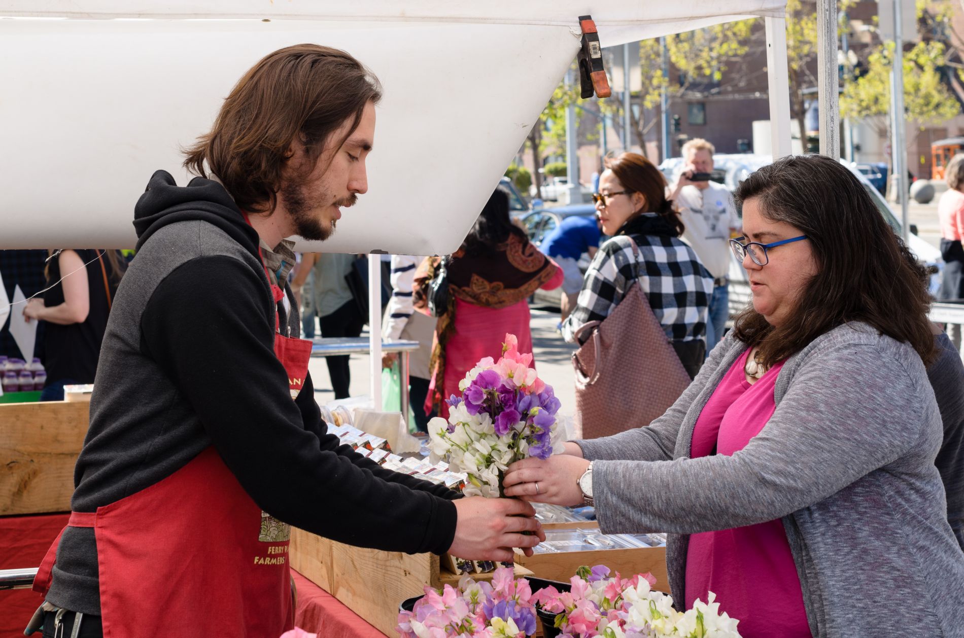 Heather buying flowers by Dale Cruse