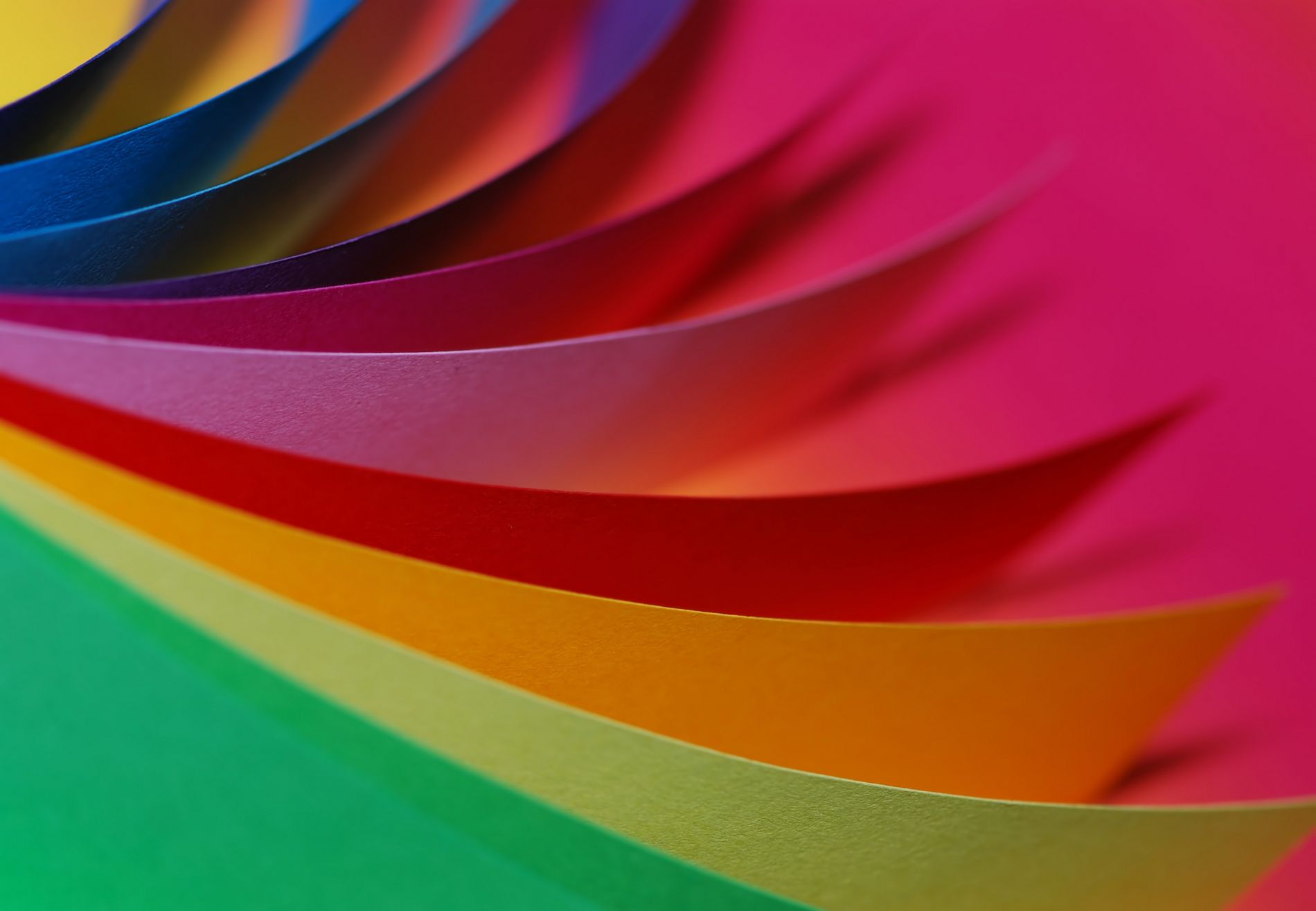 Ten pieces of colourful card paper are displayed fanned out