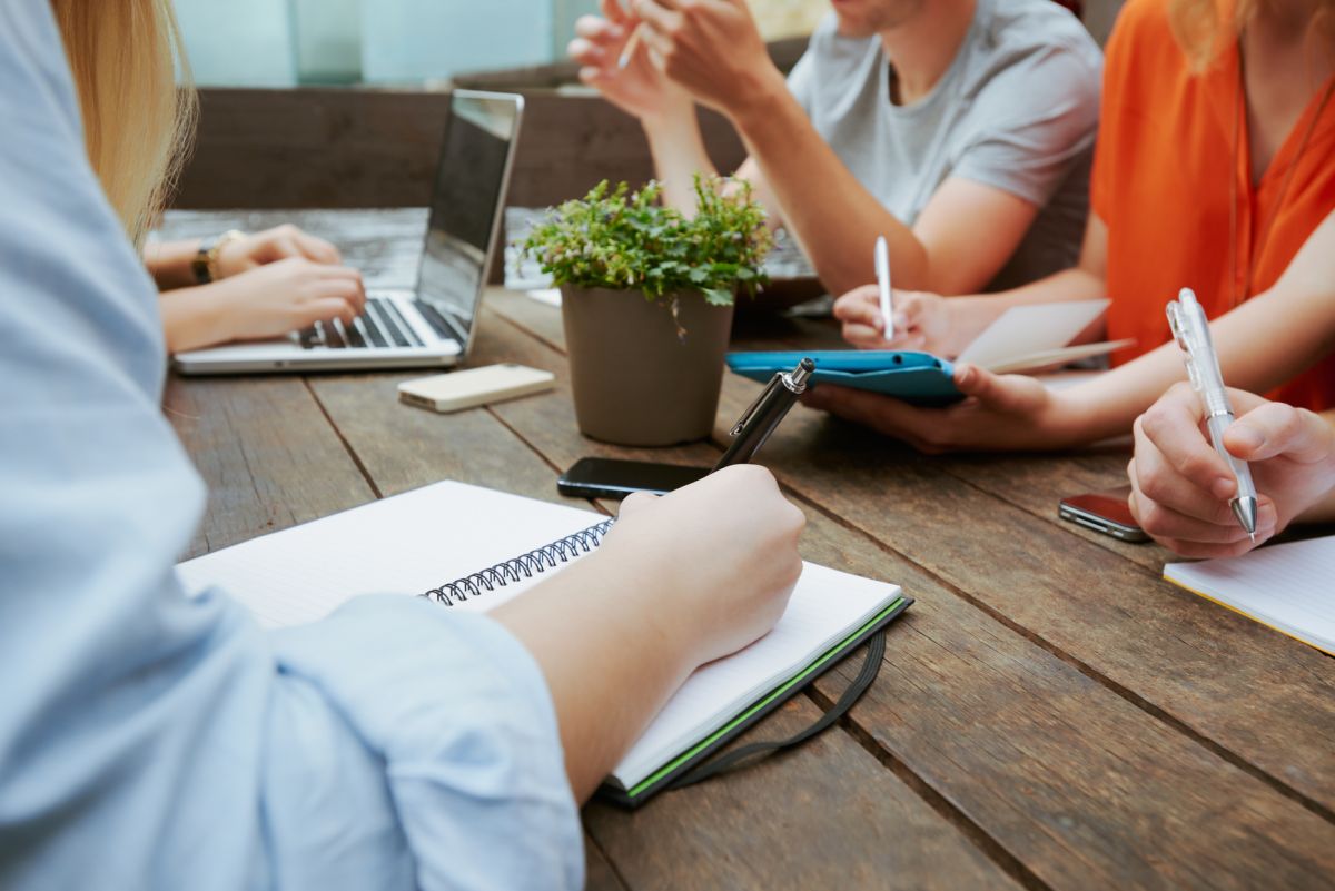 Young entrepreneurs having a creative business meeting in a cafe