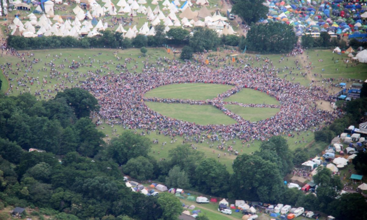 Biggest human peace sign at Glastonbury by Andy Eliot